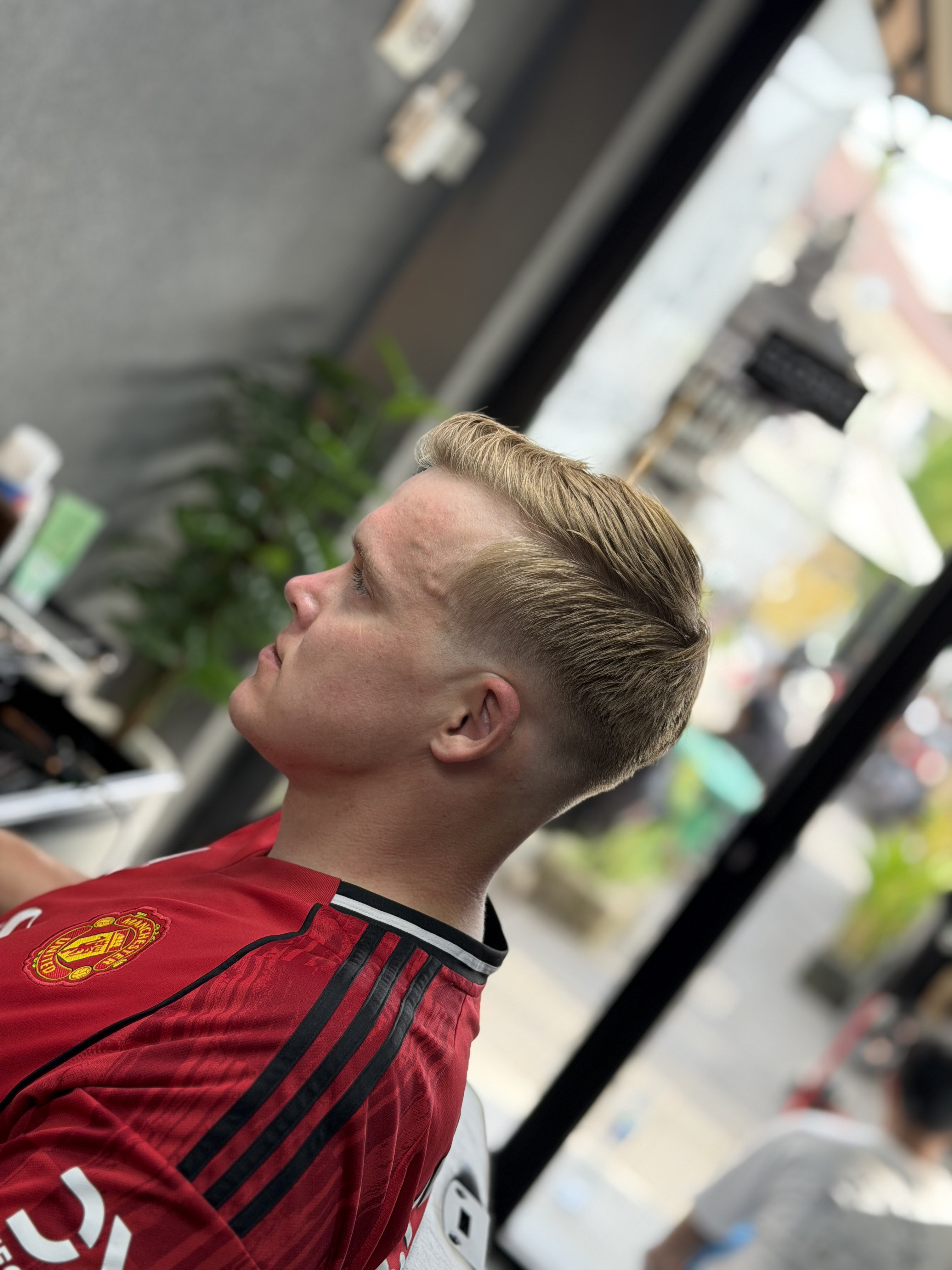 Long hair trim by Triple Line Barbershop